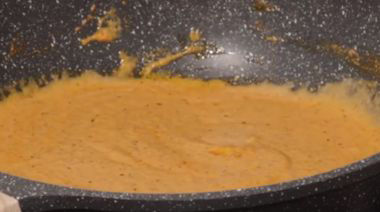 Shahi paneer in rich creamy gravy garnished with cream